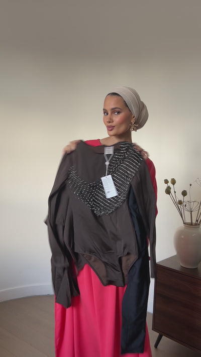 Jasmine Omar wearing Amara Full Set Brown with black swim skirt by Turana Atash London